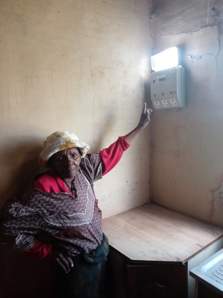 A customer shows off the light in her new home.