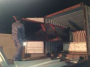 Loading up the container - well after sunset...