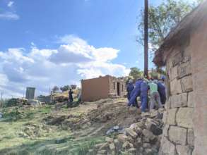 Adding stay wires to poles at Ha Makebe
