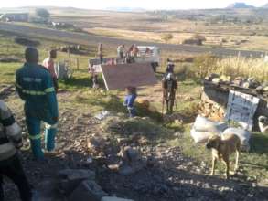 Everyone pitches in to unload rebuilding materials