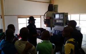 Students learn about CNC milling from Marcel