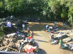 washing clothes in the river
