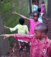 Kids feeling the wall of their new home.
