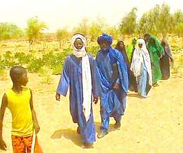 Gao families walking out to women's & youth garden