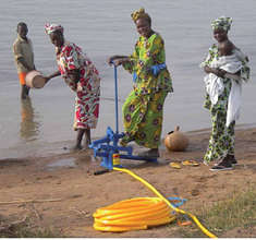 Women at the Niger River pumping irrigation water