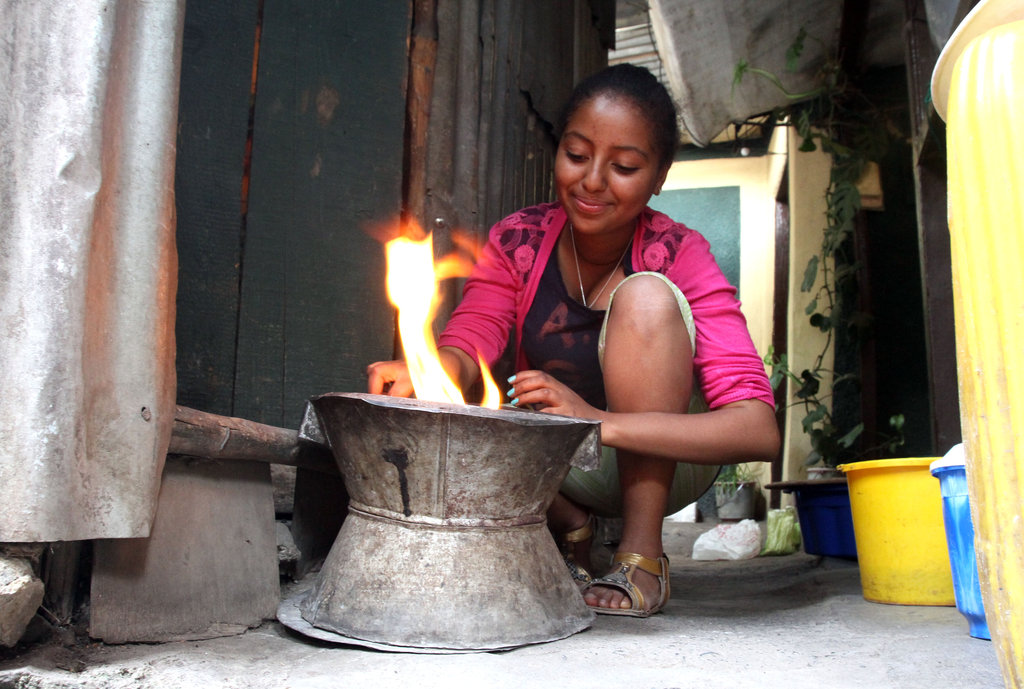 Tsion making coffee at home
