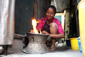 Tsion making coffee at home