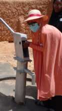 Our team member putting the handpump in order