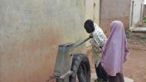One of the rehabilitated hand pumps