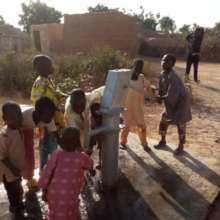 Kids showing their delight to getting water