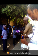 Demonstrating how to wash hands properly