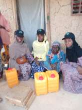 Our mother being given water jugs
