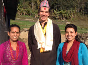 Michael Cole with clinic midwives, Mina and Bina.