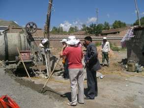 Dr. Tseringy Kyi mixing cement