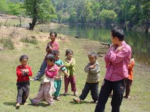 kids are singing and dancing with teachers