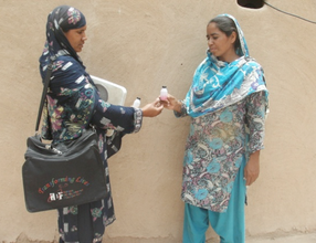 Tahira and a Health Worker