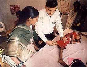 Physiotherapy for a disabled child by a specialist