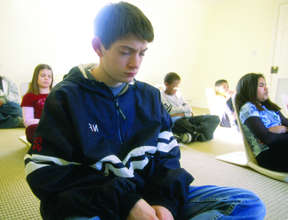 Group meditation at a school