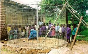 School children participate in tank construction