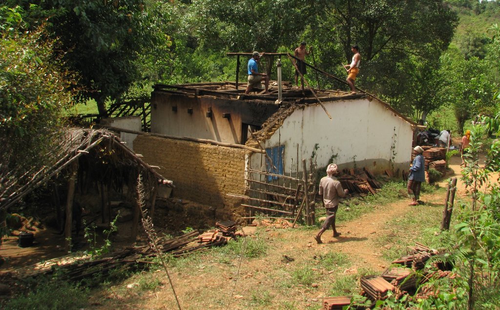 Uruni villagers dismantling their houses