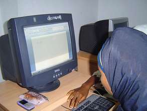 Young disabled woman using computer for first time