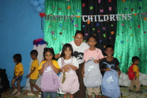 Preschool coordinator with the students