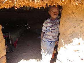 A little boy waits for his next meal