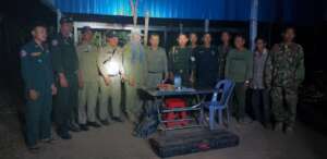 Team and rangers with evidence seized from truck