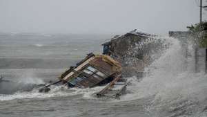 Coastal Houses Wash Away (Source: AP)