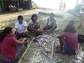 Women in Buluang barangay with the daily catch