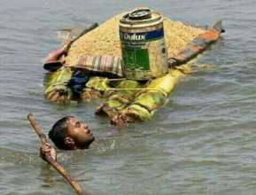 A man is risking his life for few kilo of rice....