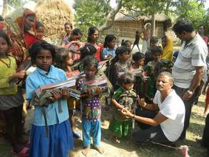 Girls receiving study materials