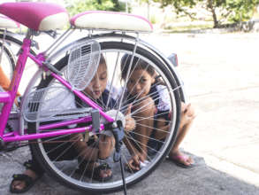 Cleaning their bikes.