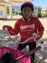 Thi and her pink bike!