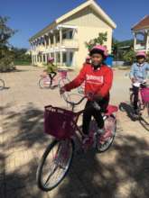 Thi and her new bicycle and helmet