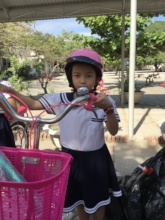 Thuy and her new bike.