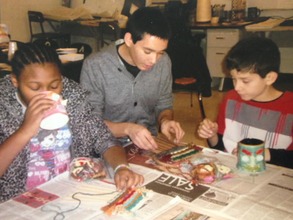 James helping two students work on a weaving!