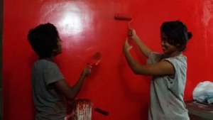Kavita & I painting the staff room.