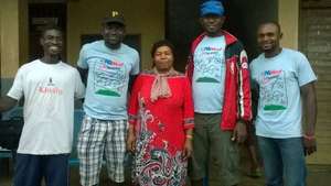 Coaches stand with Madam Director of Female Fball