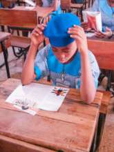 A Girl Reading an information material