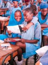 Girls Reading Information on Teenage Pregnancy