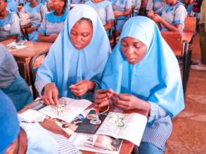 Girls Making a Demo Cycle Beads
