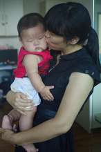 Yan Feng gets kisses and cuddles from his teacher