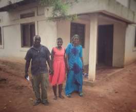 Sarafina and her parents in Mwandiga