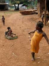 Children playing with an old suitcase
