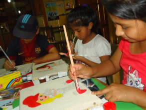 Children painting at the Ludoteca