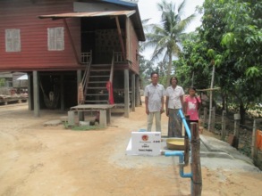 A rural Cambodian family with their new well.