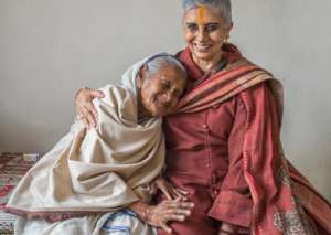 Our founder shares a warm moment with a widow