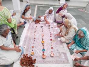 Mothers making diyas