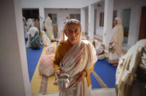 Nirmala, collecting the daily supply of milk